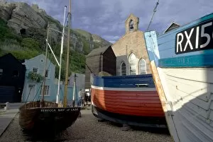 Fishing boats and historic buildings, Hastings, Sussex, England, United Kingdom, Europe