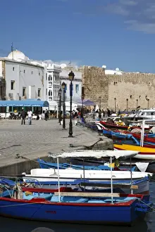 Bizerte Prints: Fishing boats, old port canal with kasbah wall in background, Bizerte, Tunisia