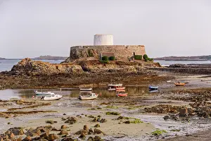 Fishermen Prints: Fishing boats rest on tidal sands near historic Fort Grey in Rocquaine Bay