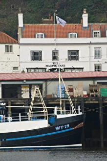 Images Dated 31st October 2009: Fishing boats in Whitby harbour with the famous Magpie Cafe in the background
