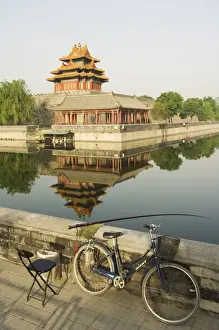 Fishing Rod Prints: Fishing in the moat with a reflection of the Palace Wall Tower of The Forbidden City Palace Museum