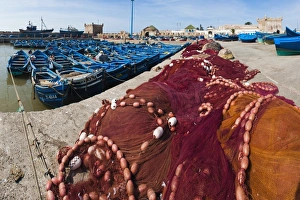 Fishing Nets Prints: Fishing nets and blue fishing boats in Essaouira Port