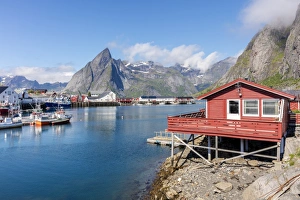 Stilt House Prints: Fishing village and harbour framed by peaks and sea, Hamnoy, Moskenes, Nordland county
