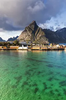 Sakrisoy Prints: Fishing village of Sakrisoy with Olstinden mountain on background, Reine, Nordland