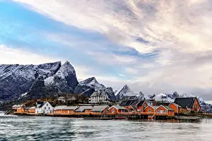 Sakrisoy Prints: Fishing village with wooden houses near water and mountains in Lofoten Islands