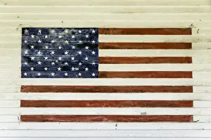 Us Flag Prints: US Flag painted on the side of a wooden building in the historic area of Chatham