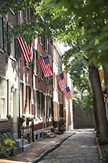 Images Dated 21st July 2007: Flags displayed on homes on cobblestone American Street, in the Society Hill neighborhood of