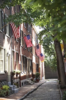 Images Dated 21st July 2007: Flags displayed on homes on cobblestone American Street, in the Society Hill neighborhood of Philadelphia