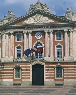 Civic Collection: Flags flying below a clock on the Capitole building in Toulouse, Haute Garonne