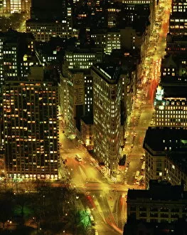 The Flat Iron Building and Broadway illuminated at night, viewed from the Empire State Building