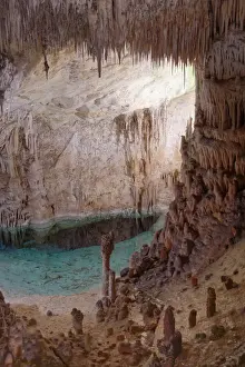 Mallorca Prints: Flooded limestone cave interior with many stalactites and stalagmites and reflections