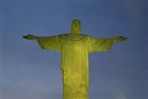 Flood Lit Prints: Floodlit statue of Christ the Redeemer at 710m on Mount Corcovado, above Rio de Janeiro