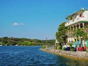 Recreational Prints: Flores Island lakefront with buildings and clear sky in Peten Department, Guatemala