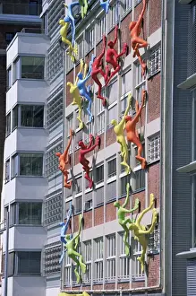 Humor Prints: Flossies figures covering a building facade at the Medienhafen