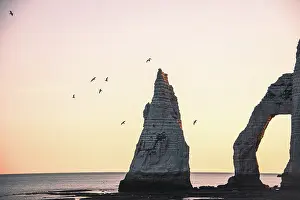Etretat Prints: Fly past Needle Aiguille dEtretat and Arch Rock Falaise dAval formations at sunrise in Normandy