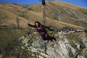One Young Woman Only Prints: Flying fox, flying on wire over canyon, Queenstown, South Island, New Zealand, Pacific