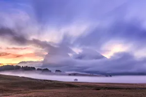 Bolzano Prints: The fog hides a cabin and the Sassolungo group at dawn, Seiser Alm, Dolomites