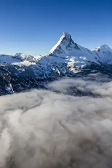 Massif Prints: Fog revealing the mountain range surrounding the massif of the Matterhorn