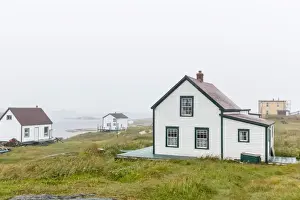 Traditionally Canadian Prints: Fog rolls in over the small preserved fishing village of Battle Harbour
