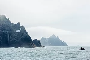 Lighthouse Gallery: Fog shrouds the Skellig Islands, Great Skellig Michael in the foreground, Little Skellig behind
