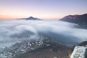 Lecco Prints: Fog at sunrise above the city of Lecco seen from Monte San Martino, Province of Lecco