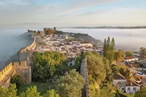 Fortified Wall Prints: Fog at sunrise over Obidos old town and rampart defensive walls