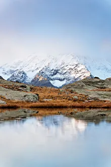 Valtellina Prints: Foggy sunrise over the majest Monte Disgrazia in autumn
