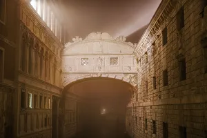 Light Beam Prints: Foggy view without crowd of Ponte de Sospiri, iconic Bridge of Sighs stone bridge