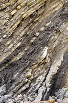 L Imestone Prints: Folded layers of Jurassic sedimentary limestone and marl rocks in the cliffs at Vega beach