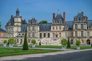 Chateau Prints: Fontainebleau palace showcases architecture and gardens under clear sky in France