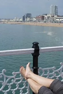Images Dated 21st May 2010: Foot sunbathing on the pier, Brighton, Sussex, England, United Kingdom, Europe
