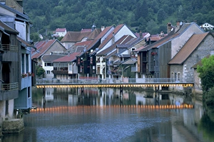 Franche Comte Prints: Footbridge illuminated at dusk and houses along the Loue River, Ornans