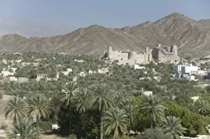 Fort in palmery on edge of modern oasis town, Bahla, Oman, Middle East