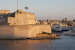 Valletta Prints: Fort St. Angelo, fishing boat and Vittoriosa (Birgu) at sunset