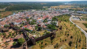 Roads Prints: Fortified city of Silves in Algarve shows historical buildings and landscape from above