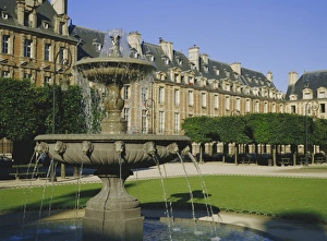 Fountain in the Place des Vosges, Paris, France, Europe