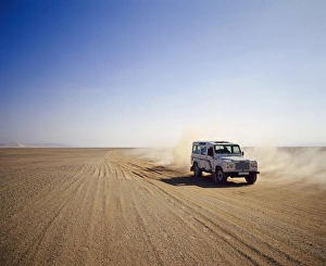 Algeria Prints: Four-wheel drive Landrover, off-roading in the desert, Algeria, Africa
