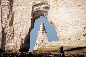 Attractions Prints: Framing LAiguille through Porte dAval arch at Etretat on the Alabaster Coast in Normandy