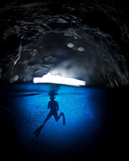 Swimming Prints: Free diving in a cave off Espanola Island, Galapagos, South America
