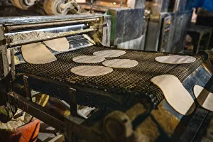Kitchen Prints: Fresh Roti being made on a conveyor belt at the Golden Temple
