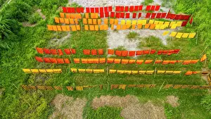 Hanging Prints: Freshly dyed cloth drying under the sun in Araihazar village in Bangladesh showcasing vibrant colors