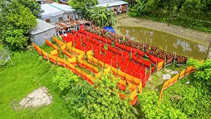 Bright Prints: Freshly dyed cloths drying outside in Araihazar village of Bangladesh during the day under the sun