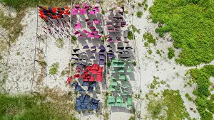 Hanging Prints: Freshly dyed cloths drying in the sun in Araihazar village in Bangladesh with various colors spread out on lines