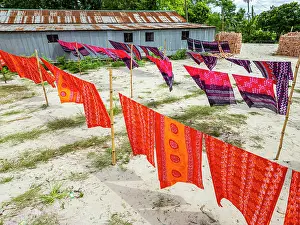 Bright Prints: Freshly dyed cloths hang to dry under the sun in Araihazar village in Bangladesh