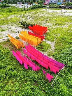 Hanging Prints: Freshly dyed cloths hanging in bright colors in Araihazar village
