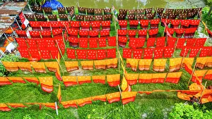 Bright Prints: Freshly dyed cloths hanging under the sun in a village in Bangladesh