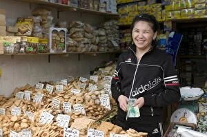 Images Dated 8th September 2009: Friendly woman selling biscuits at a market stand, Alma Ata, Kazakhstan