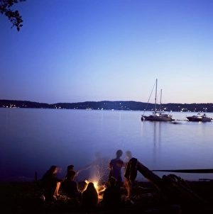 Friends around beach fire