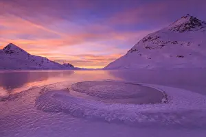 Bernina Prints: Frost creating unusual shapes in the middle of Lake Bianco at Bernina illuminated by the light of sunrise