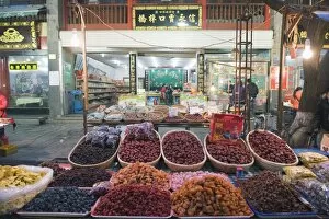 Fruit stands at a street market in the Muslim area of Xian, Shaanxi Province, China, Asia